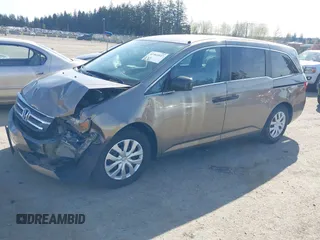 2013 Honda Odyssey LX z VIN 5FNRL5H29DB055166, wystawiony jako IAAI lot #41965037 z przebiegiem 122 470 mil mil oraz . Historia ofert i sprzedaży dostępna na DreamBid. Obrazek 17.