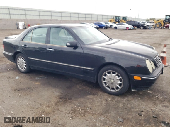 2000 Mercedes-Benz E-Class with VIN WDBJF65J5YB068297, listed as a Copart auction lot 69199004 with 236,751 mi miles and Salvage Title. Bid and sale history available at carsss.com. Image 4.