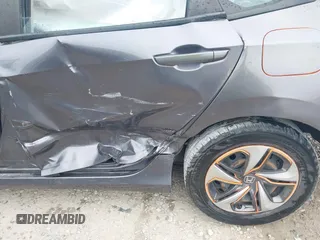 2020 Honda Civic LX z VIN 19XFC2F66LE012481, wystawiony jako IAAI lot #42297600 z przebiegiem 56 602 mil mil oraz . Historia ofert i sprzedaży dostępna na DreamBid. Obrazek 12.