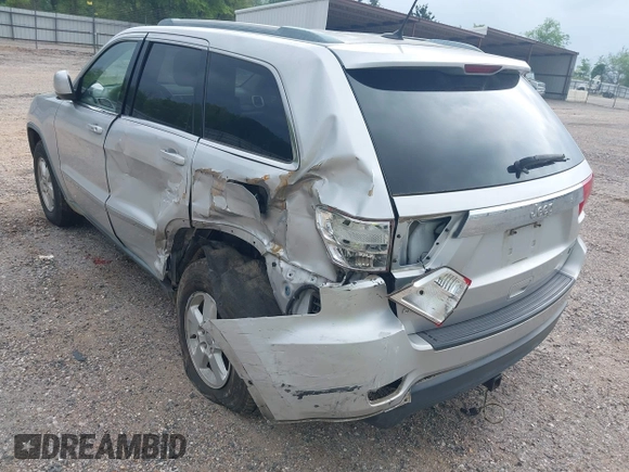2011 Jeep Grand Cherokee Laredo with VIN 1J4RS4GGXBC564035, listed as a IAAI auction lot 41931861 with 242,291 mi miles and . Bid and sale history available at DreamBid. Image 12.