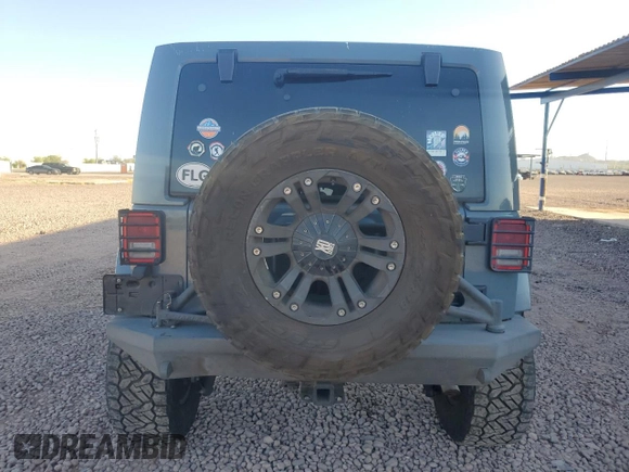 2014 Jeep Wrangler Unlimited Rubicon with VIN 1C4HJWFG9EL199501, listed as a Copart auction lot 61443595 with 86,940 mi miles and Salvage title. Bid and sale history available at DreamBid. Image 6.