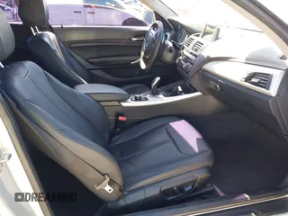 2015 BMW 2 Series 228i with VIN WBA1F5C58FV257570, listed as a IAAI auction lot 41783929 with 229,893 mi miles. Bid and sale history available at carsss.com. Image 5.