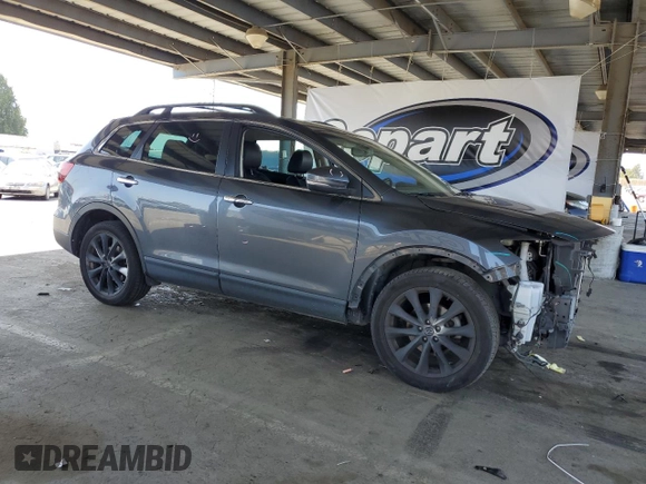 2015 Mazda CX-9 Grand Touring z VIN JM3TB3DV2F0456130, wystawiony jako Copart lot #55787935 z przebiegiem 120 888 mil mil oraz Szkoda całkowita • Salvage title. Historia ofert i sprzedaży dostępna na DreamBid. Obrazek 4.