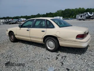 1996 Ford Crown Victoria LX с VIN 2FALP74W1TX192976, выставлен на аукционе Copart как лот 56104895 с пробегом 144 011 миль миль и Списание • Salvage title. История ставок и продаж доступна на DreamBid. Изображение 2.