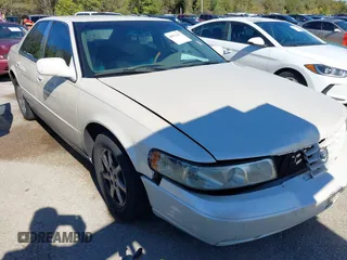 2002 Cadillac Seville Luxury SLS z VIN 1G6KS54Y52U231880, wystawiony jako IAAI lot #40911457 z przebiegiem 148 100 mil mil oraz . Historia ofert i sprzedaży dostępna na DreamBid. Obrazek 1.