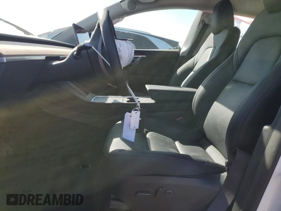 2024 Tesla Model Y Long Range with VIN 7SAYGDEE0RF081948, listed as a Copart auction lot 52612805 with 12,099 mi miles and Salvage Title. Bid and sale history available at DreamBid. Image 7.