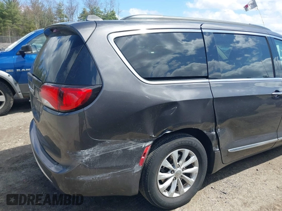 2017 Chrysler Pacifica Touring L with VIN 2C4RC1BGXHR667397, listed as a IAAI auction lot 42085117 with 63,996 mi miles and . Bid and sale history available at DreamBid. Image 6.