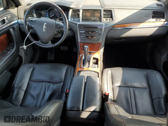 2013 Lincoln MKS with VIN 1LNHL9EK0DG612314, listed as a Copart auction lot 52901685 with 124,828 mi miles and Salvage title. Bid and sale history available at DreamBid. Image 8.