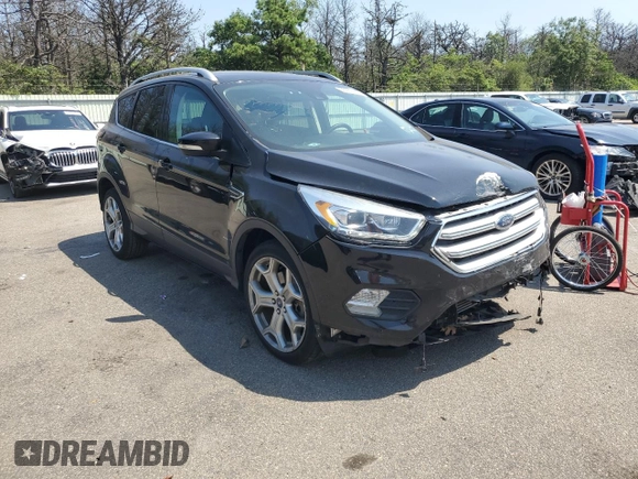 2018 Ford Escape Titanium with VIN 1FMCU9J97JUB94406, listed as a Copart auction lot 66663215 with 96,482 mi miles and Salvage title. Bid and sale history available at DreamBid. Image 4.