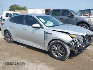 2019 Kia Optima LX z VIN 5XXGT4L37KG281329, wystawiony jako IAAI lot #42434855 z przebiegiem 113 448 mil mil oraz . Historia ofert i sprzedaży dostępna na DreamBid. Obrazek 1.