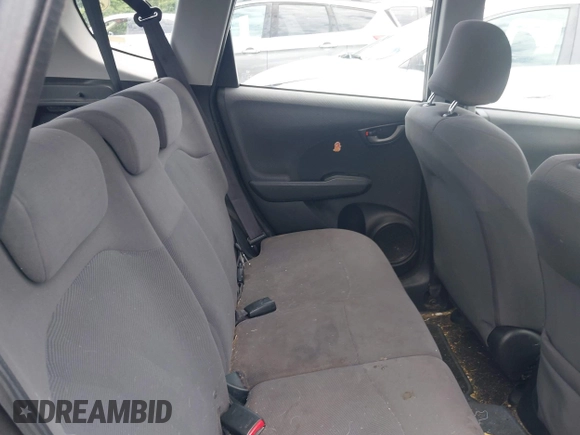 2010 Honda Fit z VIN JHMGE8H2XAS020698, wystawiony jako IAAI lot #42549063 z przebiegiem 260 454 mil mil oraz . Historia ofert i sprzedaży dostępna na DreamBid. Obrazek 8.