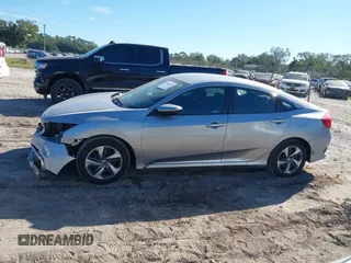 2020 Honda Civic LX with VIN 19XFC2F62LE009433, listed as a IAAI auction lot 40963670 with 117,865 mi miles and . Bid and sale history available at DreamBid. Image 14.