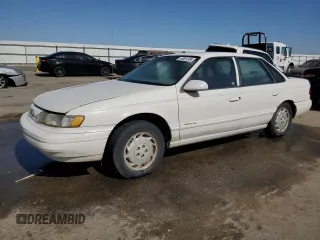 1994 Ford Taurus GL z VIN 1FALP52U7RG261559, wystawiony jako Copart lot #55681304 z przebiegiem 28 675 mil mil oraz Szkoda całkowita • Salvage title. Historia ofert i sprzedaży dostępna na DreamBid. Obrazek 1.