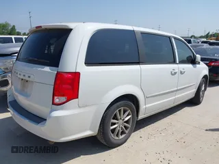 2015 Dodge Grand Caravan SE with VIN 2C4RDGBG9FR691462, listed as a IAAI auction lot 42197050 with 124,239 mi miles and . Bid and sale history available at DreamBid. Image 4.
