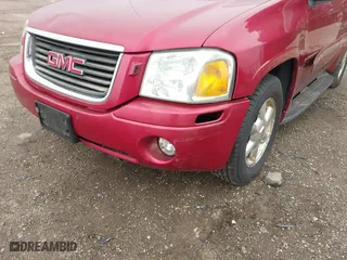 2003 GMC Envoy SLE with VIN 1GKDT13S932334925, listed as a IAAI auction lot 42071477 with 232,935 mi miles. Bid and sale history available at carsss.com. Image 6.