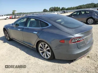 2014 Tesla Model S 60 с VIN 5YJSA1H15EFP49412, выставлен на аукционе Copart как лот 60476835 с пробегом 96 202 миль миль и Списание • Salvage title. История ставок и продаж доступна на DreamBid. Изображение 2.