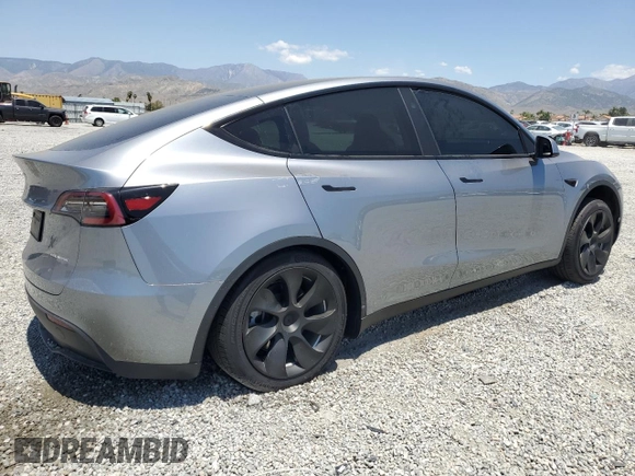2024 Tesla Model Y Long Range with VIN 7SAYGDEE0RA288420, listed as a Copart auction lot 59159015 with 7,831 mi miles and Salvage title. Bid and sale history available at DreamBid. Image 3.