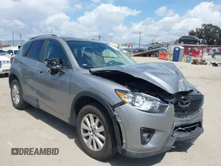 2014 Mazda CX-5 Touring with VIN JM3KE2CYXE0322943, listed as a IAAI auction lot 41934670 with 110,690 mi miles and . Bid and sale history available at DreamBid. Image 1.