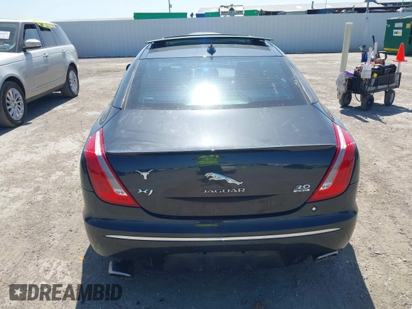 2015 Jaguar XJ R-Sport with VIN SAJWJ1CD6F8V83990, listed as a IAAI auction lot 41936162 with Not Provided miles and . Bid and sale history available at DreamBid. Image 16.