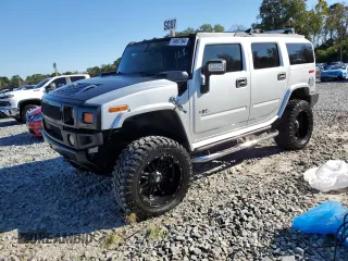 2009 Hummer H2 z VIN 5GRGN83229H102070, wystawiony jako Copart lot #74997764 z przebiegiem 169 354 mil mil oraz Szkody całkowita. Historia ofert i sprzedaży dostępna na DreamBid. Obrazek 1.