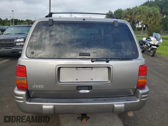 1998 Jeep Grand Cherokee Limited with VIN 1J4GZ78S2WC222768, listed as a Copart auction lot 73942154 with Not provided miles and Salvage title. Bid and sale history available at DreamBid. Image 6.