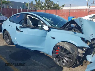 2022 Tesla Model 3 Performance with VIN 5YJ3E1EC1NF144236, listed as a IAAI auction lot 41189644 with Not Provided miles. Bid and sale history available at carsss.com. Image 13.
