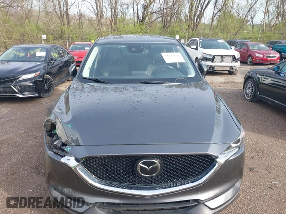 2020 Mazda CX-5 Touring with VIN JM3KFBCM8L0863951, listed as a IAAI auction lot 41921635 with 88,629 mi miles. Bid and sale history available at carsss.com. Image 6.