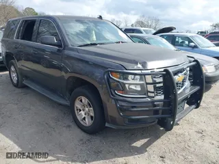 2017 Chevrolet Tahoe Commercial with VIN 1GNLCDEC2HR256539, listed as a IAAI auction lot 41718466 with 202,134 mi miles. Bid and sale history available at carsss.com. Image 1.