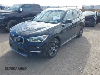 2016 BMW X1 xDrive28i with VIN WBXHT3Z3XG4A48557, listed as a IAAI auction lot 41387960 with 84,821 mi miles. Bid and sale history available at carsss.com. Image 2.