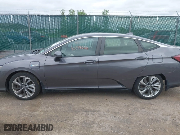 2018 Honda Clarity Touring z VIN JHMZC5F3XJC001054, wystawiony jako IAAI lot #42292688 z przebiegiem 60 780 mil mil oraz . Historia ofert i sprzedaży dostępna na DreamBid. Obrazek 14.