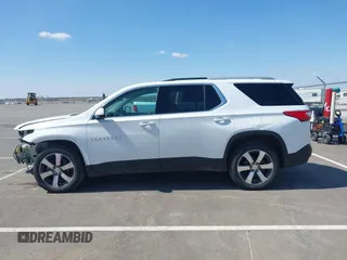2018 Chevrolet Traverse LT z VIN 1GNEVHKW3JJ125861, wystawiony jako IAAI lot #41876184 z przebiegiem 95 223 mil mil oraz . Historia ofert i sprzedaży dostępna na DreamBid. Obrazek 14.