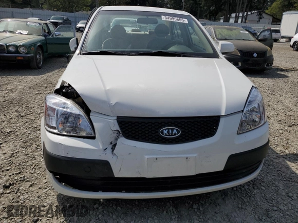 2009 Kia Rio LX with VIN KNADE223896456292, listed as a Copart auction lot 54990605 with 61,220 mi miles and Salvage Title. Bid and sale history available at DreamBid. Image 5.