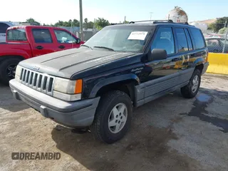 1995 Jeep Grand Cherokee Laredo z VIN 1J4GZ58S9SC553345, wystawiony jako IAAI lot #42772979 z przebiegiem 216 808 mil mil oraz . Historia ofert i sprzedaży dostępna na DreamBid. Obrazek 2.