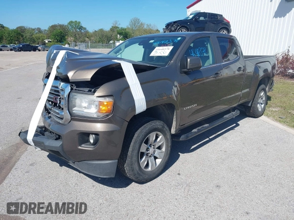 2015 GMC Canyon 2WD SLE with VIN 1GTG5BE31F1166383, listed as a IAAI auction lot 41640378 with 334,016 mi miles. Bid and sale history available at carsss.com. Image 2.