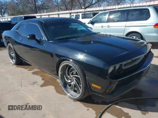 2012 Dodge Challenger SXT Plus with VIN 2C3CDYAG5CH208729, listed as a IAAI auction lot 41204390 with 216,067 mi miles. Bid and sale history available at carsss.com. Image 1.