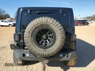2014 Jeep Wrangler Unlimited Rubicon X with VIN 1C4HJWFG8EL119654, listed as a Copart auction lot 46699055 with 148,412 mi miles and Salvage title. Bid and sale history available at DreamBid. Image 6.