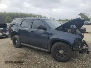2014 Chevrolet Tahoe Commercial with VIN 1GNLC2E08ER209599, listed as a Copart auction lot 51018165 with 111,585 mi miles and Salvage title. Bid and sale history available at DreamBid. Image 4.