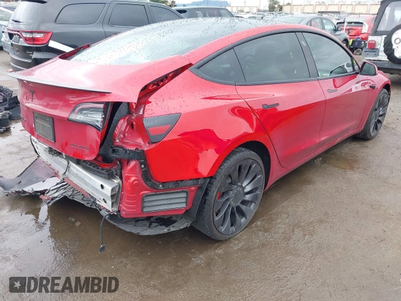 2021 Tesla Model 3 Performance with VIN 5YJ3E1EC5MF050598, listed as a IAAI auction lot 41778169 with 74,710 mi miles and . Bid and sale history available at carsss.com. Image 4.