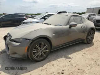 2024 Mazda MX-5 Miata Grand Touring z VIN JM1NDAM73R0608633, wystawiony jako Copart lot #53509595 z przebiegiem Nie podano mil oraz Szkoda całkowita • Salvage title. Historia ofert i sprzedaży dostępna na DreamBid. Obrazek 1.