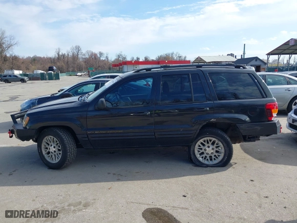 2004 Jeep Grand Cherokee Limited with VIN 1J4GW58N74C120435, listed as a IAAI auction lot 41815094 with 193,056 mi miles. Bid and sale history available at carsss.com. Image 14.