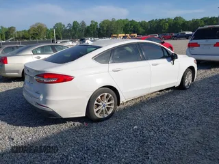 2019 Ford Fusion SE with VIN 3FA6P0LU6KR152166, listed as a IAAI auction lot 42086365 with 158,557 mi miles and . Bid and sale history available at DreamBid. Image 4.