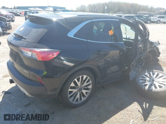 2021 Ford Escape Titanium with VIN 1FMCU9J95MUA77427, listed as a IAAI auction lot 42227275 with 75,079 mi miles and . Bid and sale history available at DreamBid. Image 4.