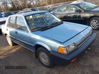 1986 Honda Civic z VIN JHMAK7439GS063929, wystawiony jako IAAI lot #41594413 z przebiegiem Nie podano mil oraz . Historia ofert i sprzedaży dostępna na DreamBid. Obrazek 1.
