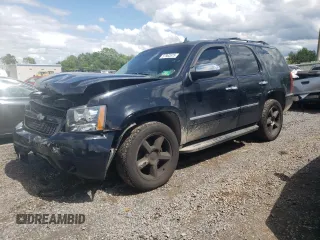 2009 Chevrolet Tahoe LTZ with VIN 1GNFK33039J125428, listed as a Copart auction lot 57962875 with 245,554 mi miles and Salvage title. Bid and sale history available at DreamBid. Image 1.