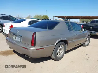 2001 Cadillac Eldorado Touring ETC z VIN 1G6ET12971B109319, wystawiony jako IAAI lot #41682779 z przebiegiem 147 515 mil mil oraz . Historia ofert i sprzedaży dostępna na DreamBid. Obrazek 4.