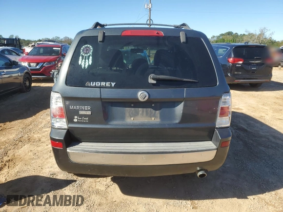 2009 Mercury Mariner Premier z VIN 4M2CU87729KJ12913, wystawiony jako Copart lot #81234994 z przebiegiem 194 091 mil mil oraz Szkoda całkowita • Salvage title. Historia ofert i sprzedaży dostępna na DreamBid. Obrazek 6.