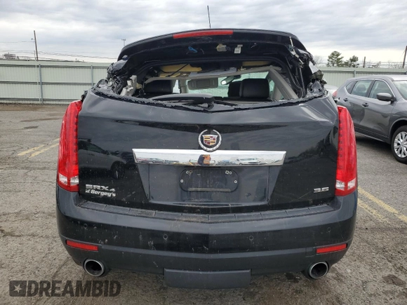 2014 Cadillac SRX Premium Collection z VIN 3GYFNGE31ES688270, wystawiony jako Copart lot #52795245 z przebiegiem 134 103 mil mil oraz Szkoda całkowita • Salvage title. Historia ofert i sprzedaży dostępna na DreamBid. Obrazek 6.