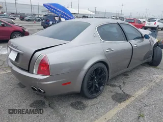 2005 Maserati Quattroporte z VIN ZAMCE39A350020161, wystawiony jako IAAI lot #41891883 z przebiegiem 82 723 mil mil oraz . Historia ofert i sprzedaży dostępna na DreamBid. Obrazek 4.