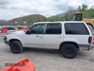 1999 Ford Explorer XLT z VIN 1FMZU34E1XZA39121, wystawiony jako IAAI lot #42107728 z przebiegiem 194 374 mil mil oraz . Historia ofert i sprzedaży dostępna na DreamBid. Obrazek 13.