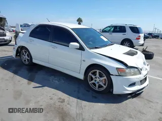 2005 Mitsubishi Lancer Evolution VIII with VIN JA3AH86DX5U054278, listed as a IAAI auction lot 41881180 with 157,497 mi miles. Bid and sale history available at carsss.com. Image 1.